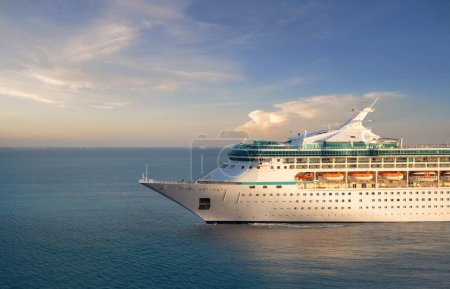 Photo for Luxury cruise ship sailing from port on sunrise - Royalty Free Image