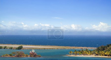 Roatan port with its beautiful water and small islands seen from a cruise ship during morning with clouds in the horizon