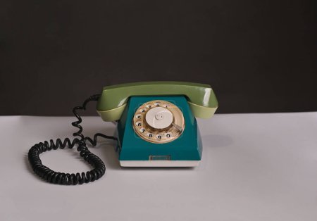 Photo for An old disk phone on a white table. High quality photo - Royalty Free Image