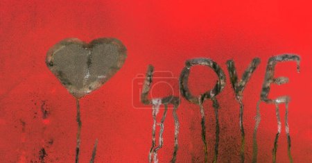 Photo for Love is written on wet glass and a heart is painted - Royalty Free Image
