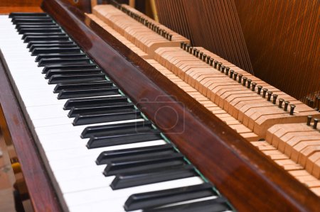 Photo for Keys on a partially disassembled piano. - Royalty Free Image