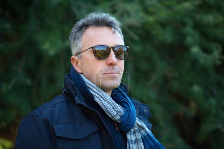 Photo for Handsome mature man. Outdoor winter male portrait. Attractive confident middle-aged man in sunglasses. - Royalty Free Image