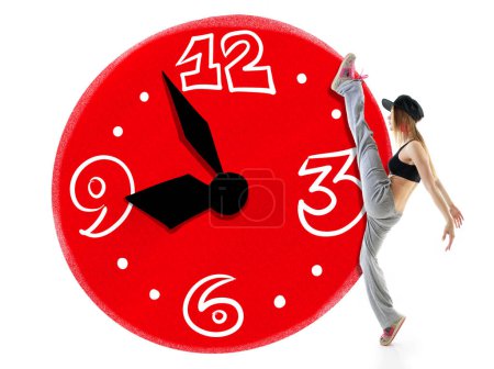 Photo for Time of great beginnings is every morning. Teen girl takes big step against the background of schematically drawn clock face over white background. Schedule and mode of the day concept - Royalty Free Image