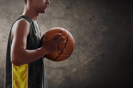 Photo for Basketball male player holding a ball - Royalty Free Image
