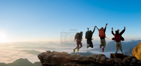 Photo for Group of happy hiker jumping on the hill. hiking holiday, wild adventure - Royalty Free Image