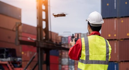Photo for Inspectors use drones to check the security inside the container yard, Cargo freight ship for Logistic Import Export - Royalty Free Image
