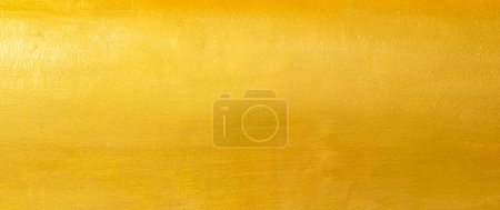 Fond de texture or avec feuille jaune luxe brillant brillant scintillement de réflexion lumineuse brillante sur la surface dorée, pour la célébration fond, papier peint, bannière de décoration de Noël, horizonta