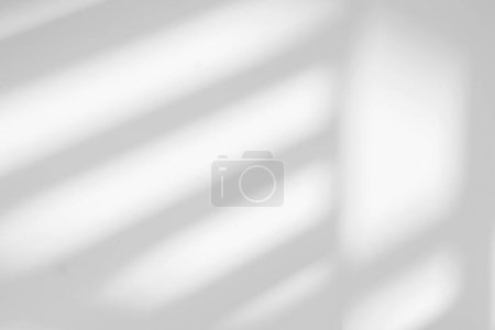 Foto de Gray shadow and light blur abstract background on white wall  from window. Dark stripe grey shadows indoor in room  background, monochrome, shadow overlay effect for backdrop and mockup desig - Imagen libre de derechos
