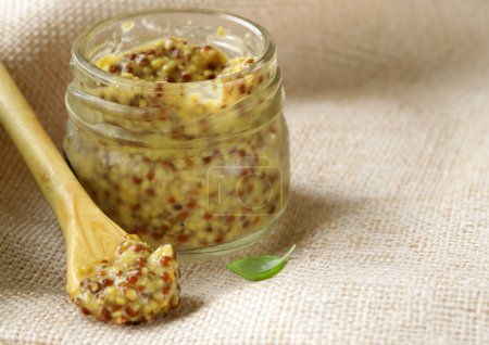 Photo for Traditional Dijon mustard condiment in a jar - Royalty Free Image