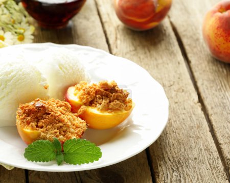 dessert baked peaches with nuts and ice cream