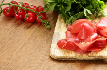 Photo for Deli meat raw smoked meat bresaola - Royalty Free Image