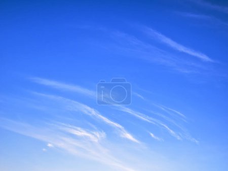 Detail of white clouds on bright blue sky, high stratospheric light white heaven, cloudscape as pattern