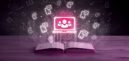 Open book with laptop icons above, social networking concept