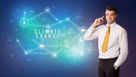 Photo for Businessman in front of cloud service icons with CLIMATE CHANGE inscription, modern technology concept - Royalty Free Image