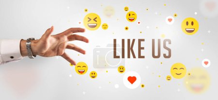 Photo for Close-Up of cropped hand pointing at LIKE US inscription, social media concept - Royalty Free Image