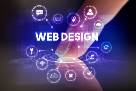 Foto de Tableta táctil de dedo con iconos de tecnología web e inscripción WEB DESIGN, concepto de tecnología web - Imagen libre de derechos