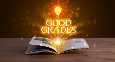Photo for GOOD GRADES inscription coming out from an open book, educational concept - Royalty Free Image