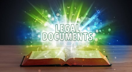 Photo for LEGAL DOCUMENTS inscription coming out from an open book, educational concept - Royalty Free Image