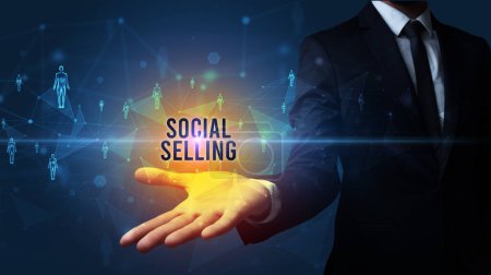 Photo for Elegant hand holding SOCIAL SELLING inscription, social networking concept - Royalty Free Image