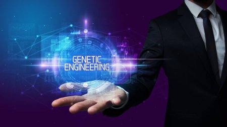 Photo for Man hand holding GENETIC ENGINEERING inscription, technology concept - Royalty Free Image