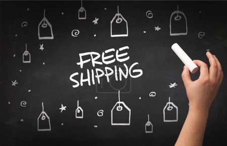 Photo for Hand drawing FREE SHIPPING inscription with white chalk on blackboard, online shopping concept - Royalty Free Image