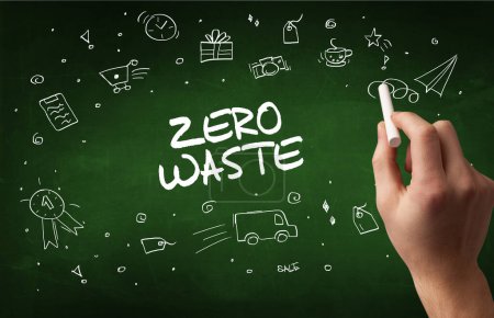 Photo for Hand drawing ZERO WASTE inscription with white chalk on blackboard, online shopping concept - Royalty Free Image