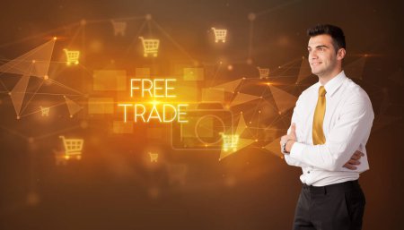 Photo for Businessman with shopping cart icons and FREE TRADE inscription, online shopping concept - Royalty Free Image