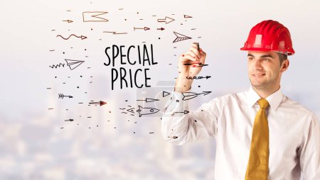 Photo for Handsome businessman with helmet drawing SPECIAL PRICE inscription, contruction sale concept - Royalty Free Image