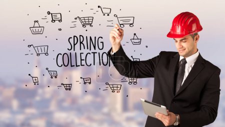 Photo for Handsome businessman with helmet drawing SPRING COLLECTION inscription, contruction sale concept - Royalty Free Image