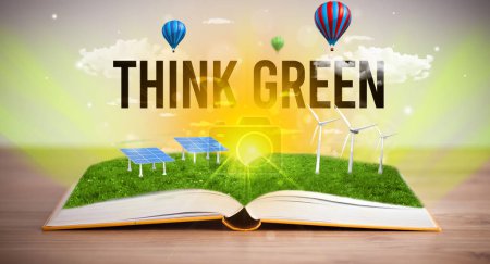 Téléchargez les photos : Livre ouvert avec inscription THINK GREEN, concept d'énergie renouvelable - en image libre de droit