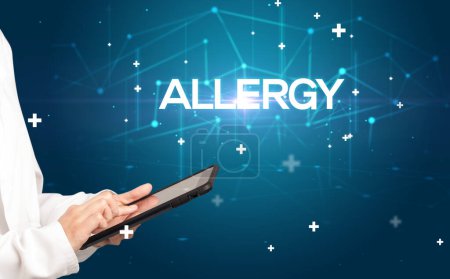 Photo for Doctor fills out medical record with ALLERGY inscription, medical concept - Royalty Free Image