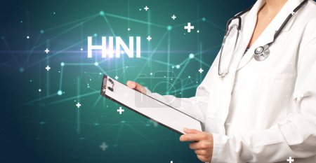 Foto de El médico llena la historia clínica con la inscripción H1N1, concepto médico - Imagen libre de derechos