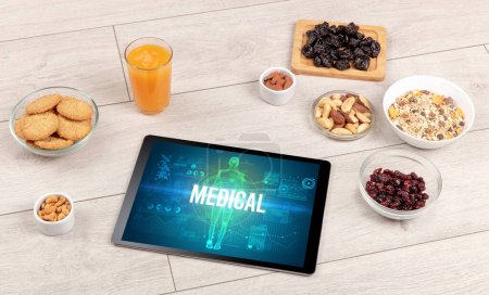 Photo for MEDICAL concept in tablet with fruits, top view - Royalty Free Image