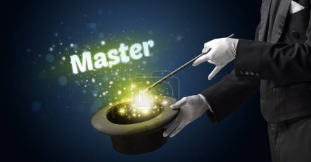 Téléchargez les photos : Magicien montre tour de magie avec Master inscription, concept éducatif - en image libre de droit