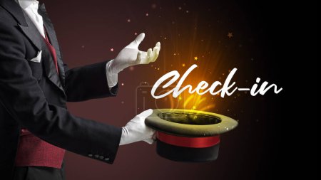 Photo for Magician is showing magic trick with Check-in inscription, traveling concept - Royalty Free Image