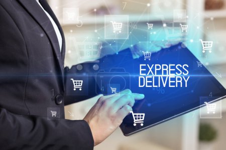 Photo for Young person makes a purchase through online shopping application with EXPRESS DELIVERY inscription - Royalty Free Image