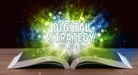 Photo for DIGITAL STRATEGY inscription coming out from an open book, educational concept - Royalty Free Image