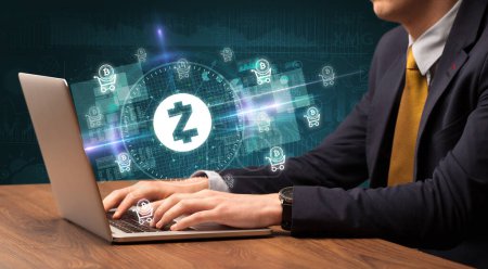 Photo for Business hand working in stock market with zcash icons coming out from laptop screen - Royalty Free Image