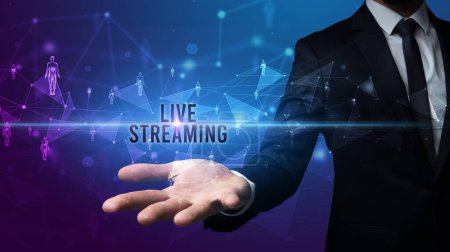 Photo for Elegant hand holding LIVE STREAMING inscription, social networking concept - Royalty Free Image