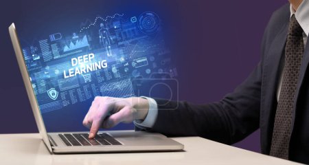 Photo for Businessman working on laptop with DEEP LEARNING inscription, cyber technology concept - Royalty Free Image