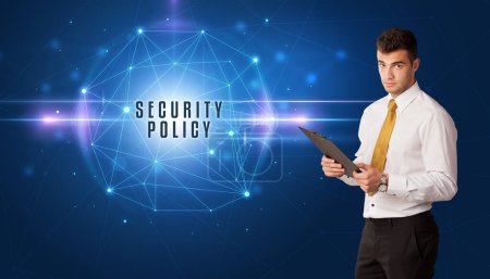 Photo for Businessman thinking about security solutions with SECURITY POLICY inscription - Royalty Free Image
