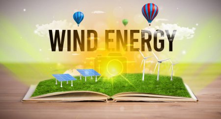 Foto de Libro abierto con inscripción WIND ENERGY, concepto de energía renovable - Imagen libre de derechos