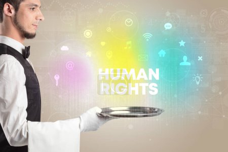 Photo for Waiter serving social networking with HUMAN RIGHTS inscription, new media concept - Royalty Free Image