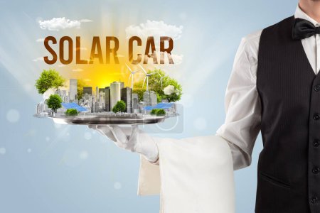 Photo for Waiter serving eco city with SOLAR CAR inscription, renewabke energy concept - Royalty Free Image