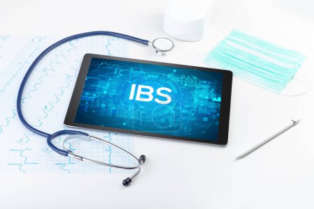 Photo for Close-up view of a tablet pc with IBS abbreviation, medical concept - Royalty Free Image