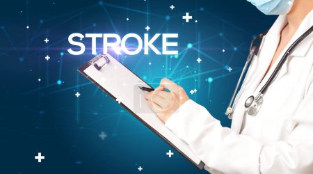 Photo for Doctor fills out medical record with STROKE inscription, medical concept - Royalty Free Image