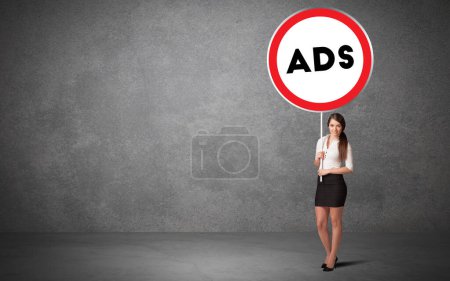 Photo for Young business person holdig traffic sign with ADS abbreviation, technology solution concept - Royalty Free Image