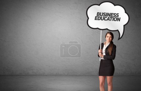 Photo for Young business person in casual holding road sign with BUSINESS EDUCATION inscription, new business idea concept - Royalty Free Image