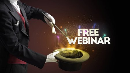 Photo for Illusionist is showing magic trick with FREE WEBINAR inscription, new business model concept - Royalty Free Image