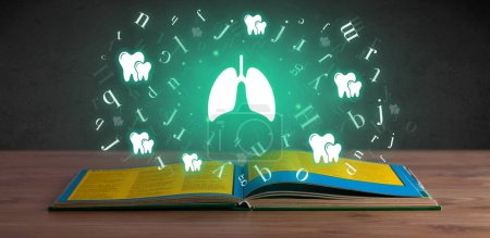 Téléchargez les photos : Livre médical ouvert avec des icônes pulmonaires ci-dessus, concept de santé mondiale - en image libre de droit